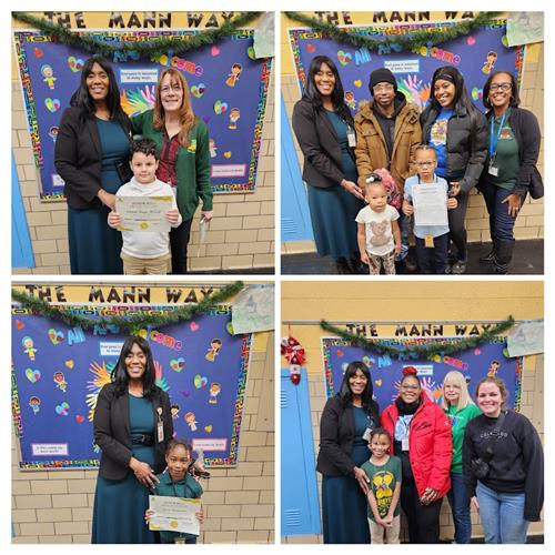 Students pose with Principal, their teacher and families with an award